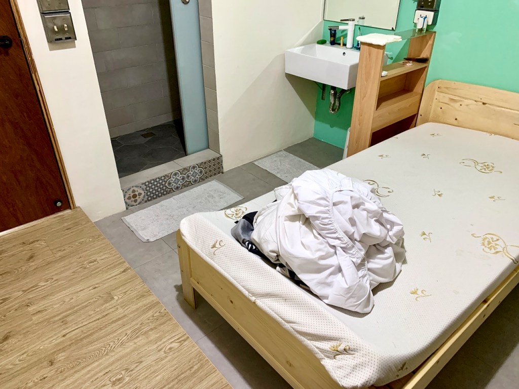 Dirty bedsheets on a single-sized bed